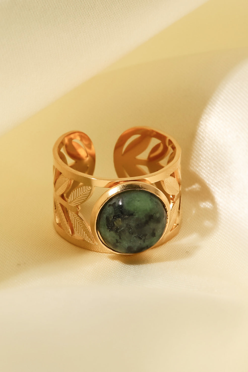 18k gold plated malachite leaf ring with detailed leaf design, showcasing vibrant green malachite stone and elegant gold plating.