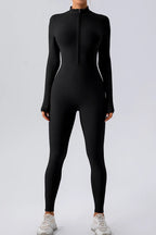 Trendsi half zip mock neck active jumpsuit in black, featuring a fitted design and breathable fabric for workout or casual wear.