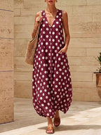 Polka dot V-neck sleeveless maxi dress by Shopimist featuring a flowing silhouette and stylish pattern.