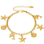 18K gold-plated sea shell charm bracelet with delicate links and ocean-inspired charms, stylish jewelry accessory.