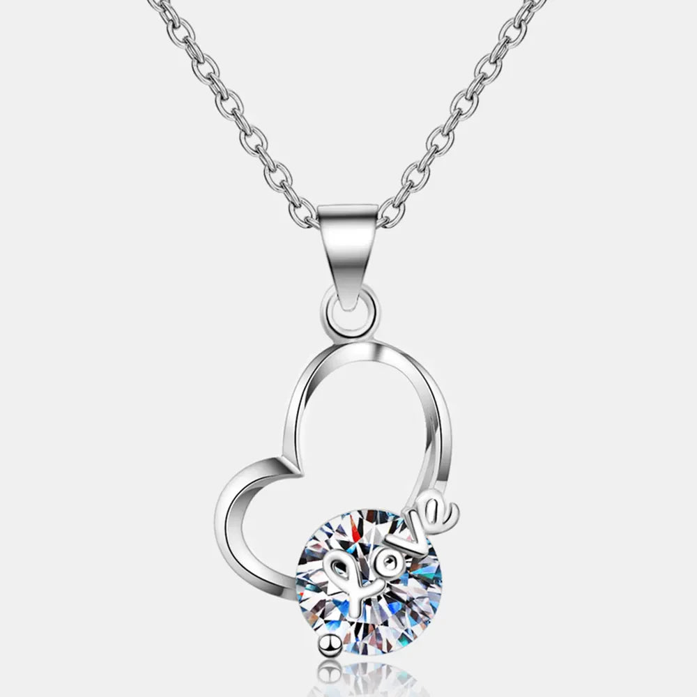 Sterling silver heart necklace with 2 carat moissanite gemstone, elegant jewelry piece from Plush Fashion Hub.