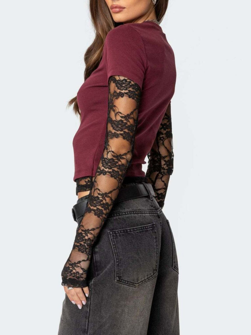 Women's fitted T-shirt by Trendsi featuring elegant lace sleeves, casual and sophisticated style, light-colored fabric.