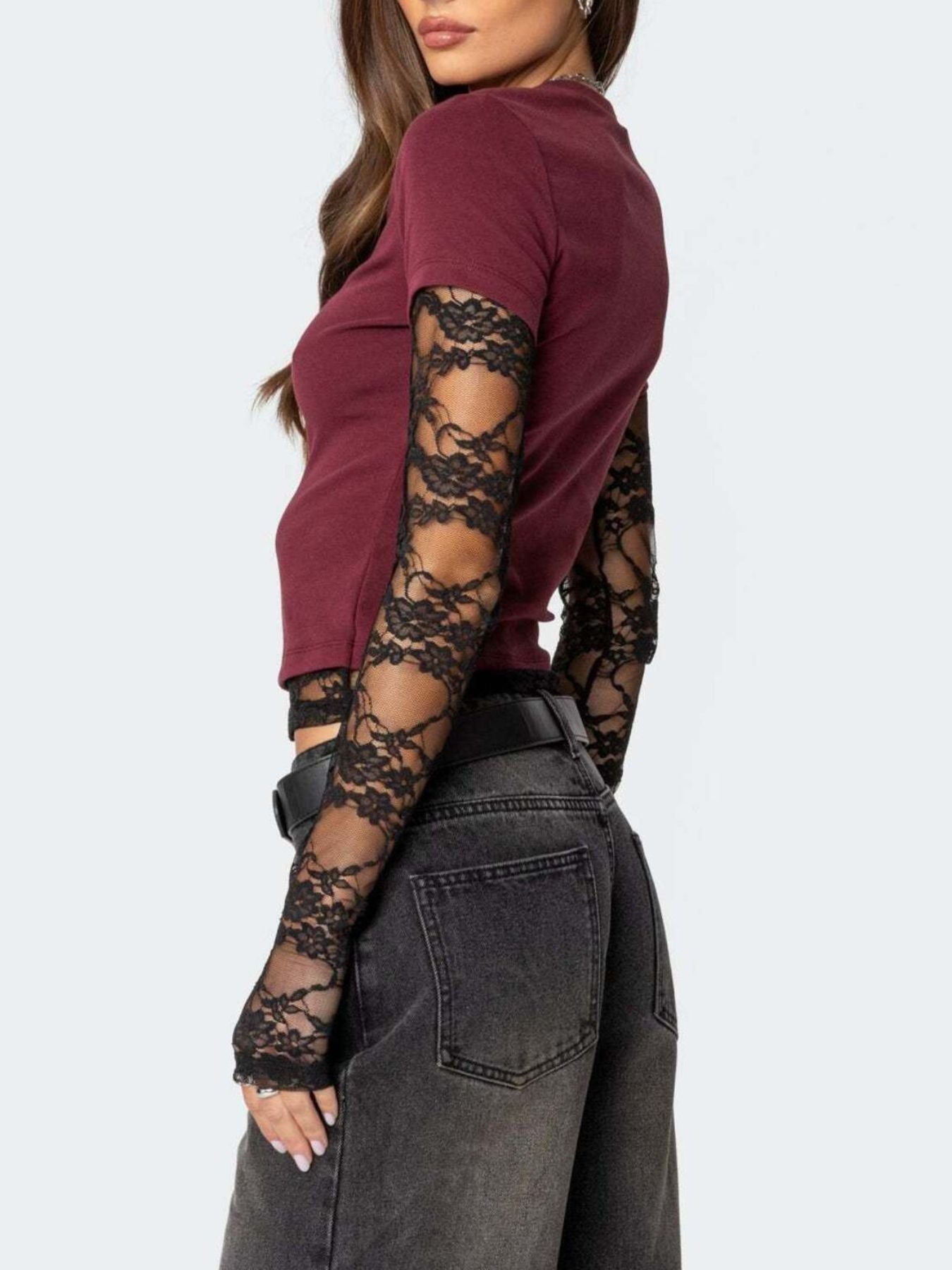 Women's fitted T-shirt by Trendsi featuring elegant lace sleeves, casual and sophisticated style, light-colored fabric.