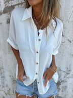 Women's collared half sleeve button-down blouse from Trendsi, featuring a sophisticated office-ready shirt with a tailored fit.