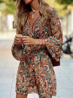 Paisley print balloon sleeve mini dress by Plush Fashion Hub, stylish boho party dress with a flowy silhouette and vibrant pattern.