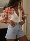 Shopimist floral print button-up shirt with long sleeves, featuring colorful flower patterns on lightweight fabric.