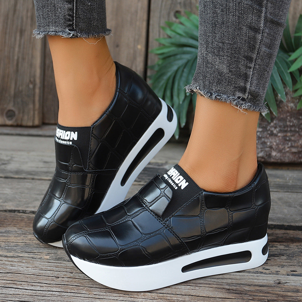 Women's crocodile pattern faux leather platform slip-on sneakers with casual style and textured crocodile design.