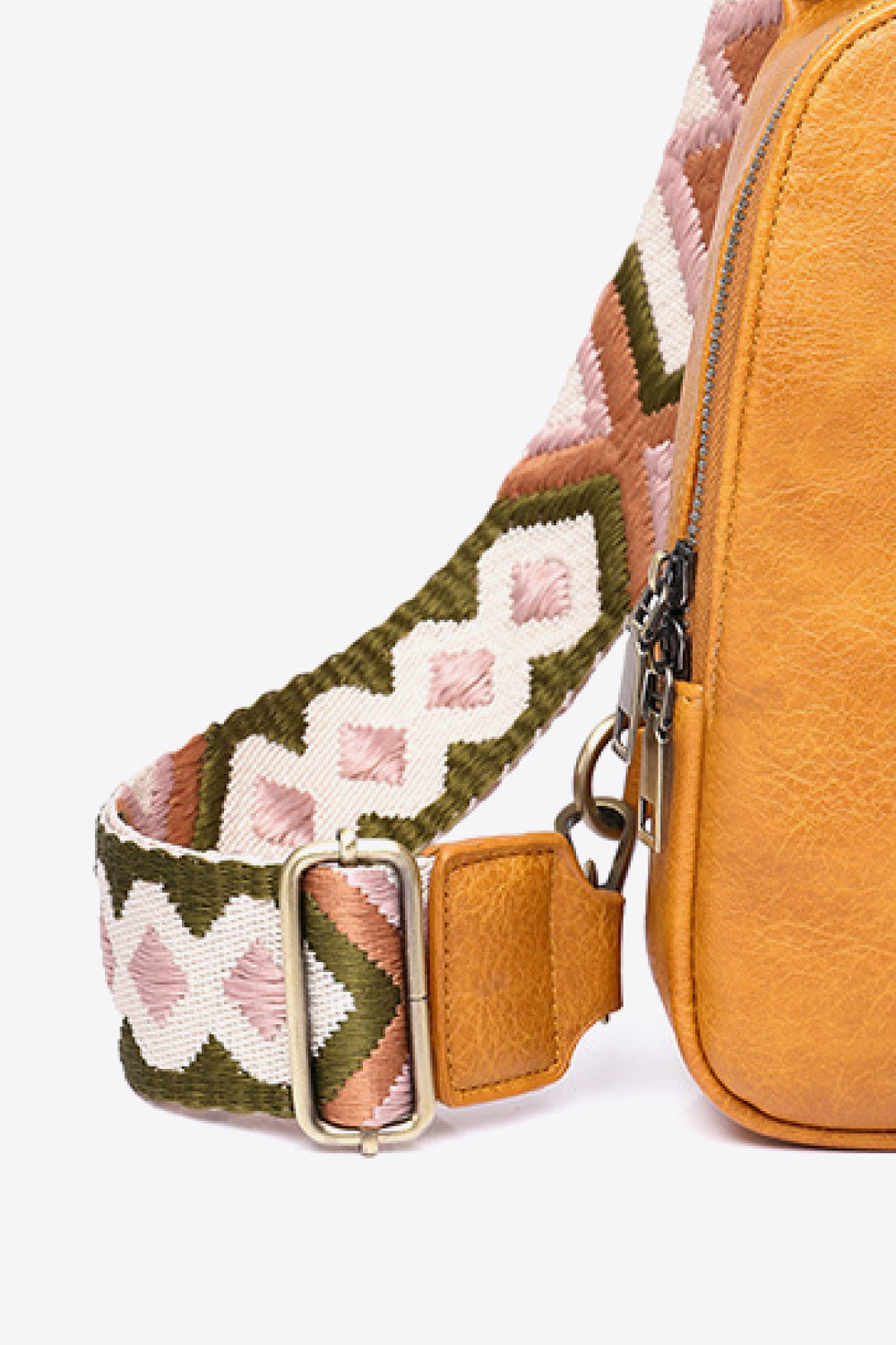 Random pattern adjustable strap PU leather sling bag with trendy design and spacious interior, perfect for casual or stylish outings.