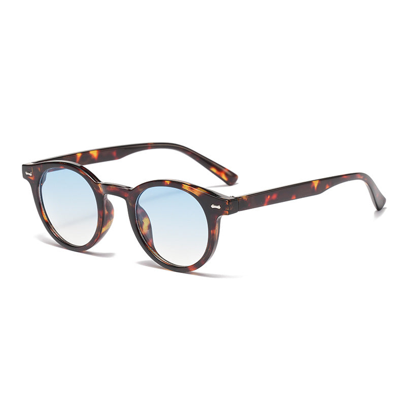 Retro round UV400 sunglasses with tinted frames by Plush Fashion Hub, showcasing classic European eye wear style.
