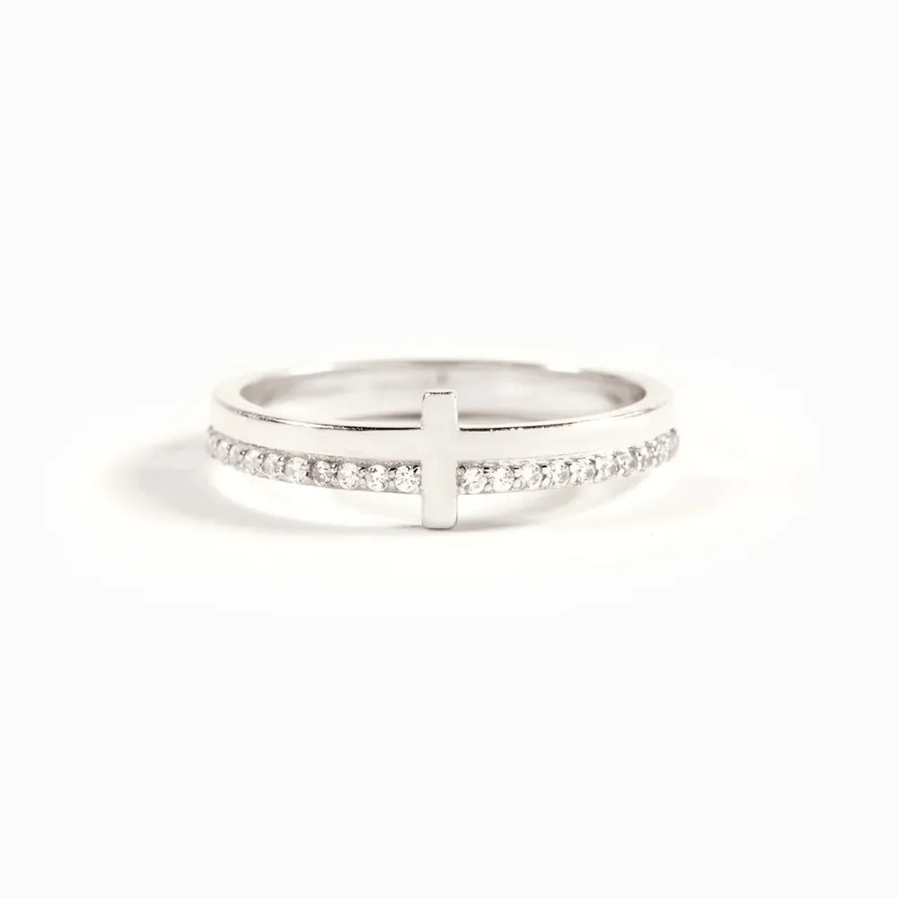 Sterling silver cross ring from Shopimist featuring a detailed cross design on a smooth band.