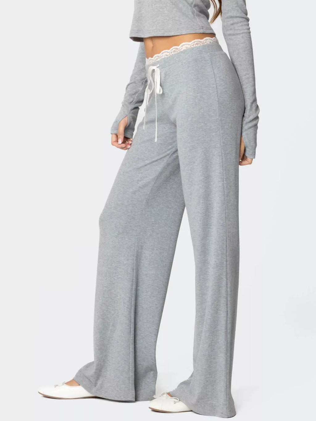 Women's wide leg lounge pants with lace trim and tie waist by Trendsi, showing soft fabric and stylish relaxed fit.
