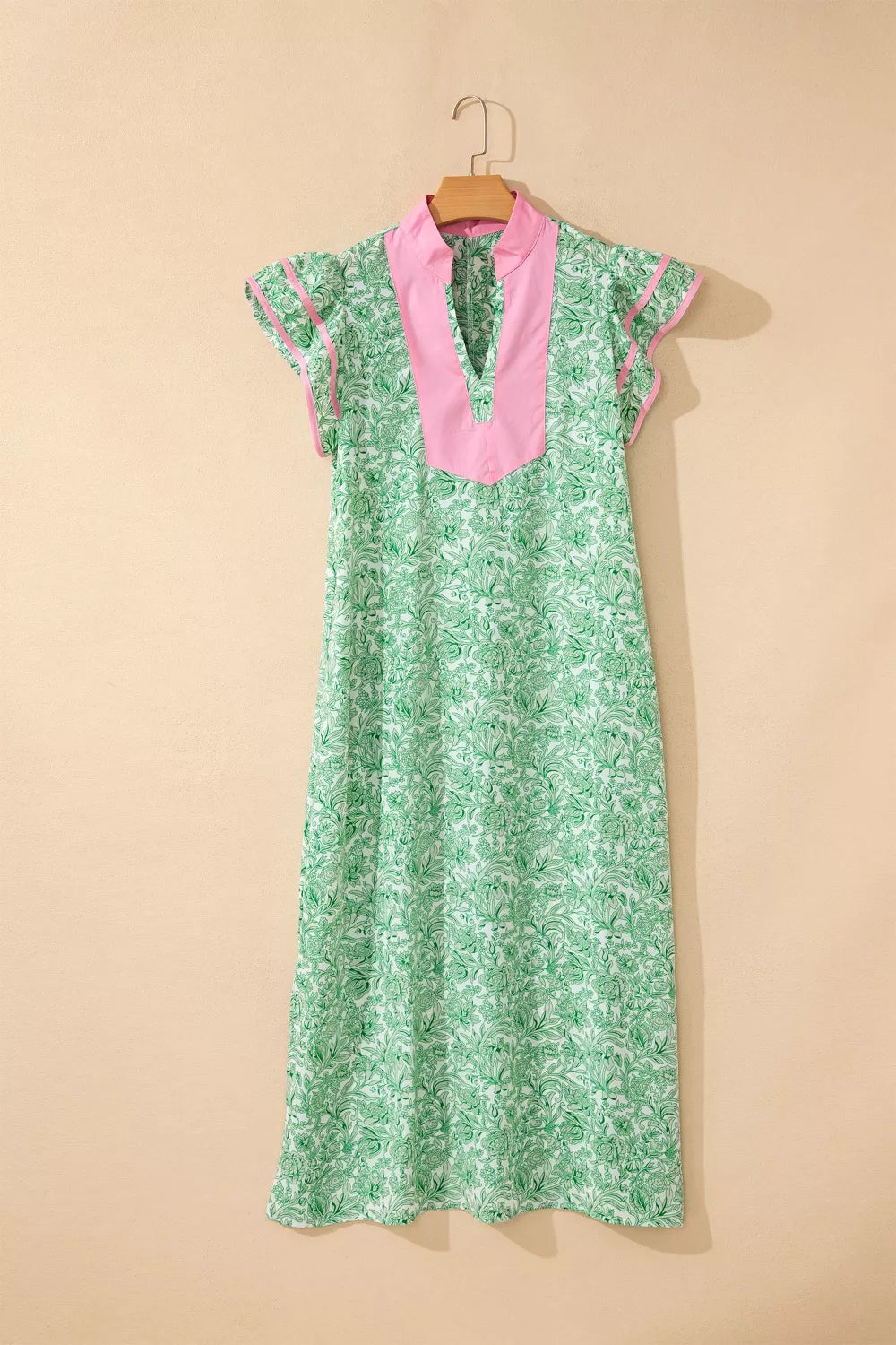 Floral midi dress with contrast trim and flutter sleeves by Plush Fashion Hub, featuring a flowy, feminine design.