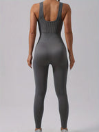 Women's ribbed sleeveless jumpsuit from FitiqueFit, made for activewear, featuring a fitted ribbed fabric and sleeveless design.