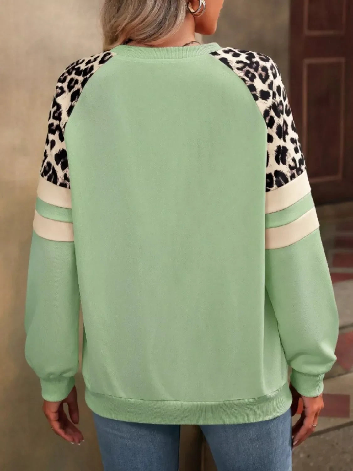 Leopard and striped raglan sleeve sweatshirt by Simply Love, featuring a casual knit design and mixed animal and stripe patterns.