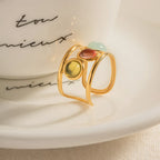 18K gold-plated gemstone open cuff ring with intricate design, showcasing vibrant gemstones and elegant craftsmanship.