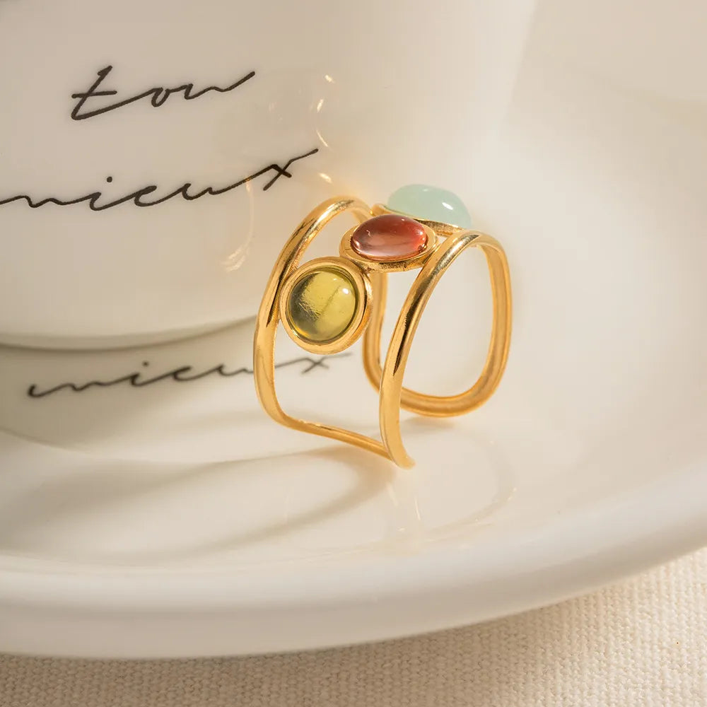 18K gold plated gemstone open cuff ring with intricate design, showcasing vibrant stones and elegant craftsmanship.