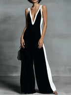 Deep V-neck wide-leg jumpsuit by Trendsi, stylish onesie with a flattering V-neck and flowing wide-leg design, shown from the front.