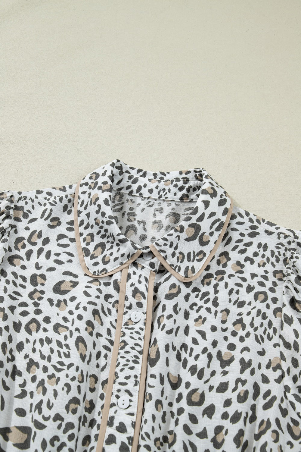 Women's leopard print button-down midi dress by Trendsi, casual chic viscose blend with long sleeves and stylish collar.