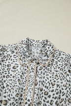 Women's leopard print button-down midi dress by Trendsi, casual chic viscose blend with long sleeves and stylish collar.