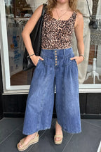 High-waisted wide-leg cotton denim jeans by Plush Fashion Hub with button fly, styled for a relaxed, classic look.