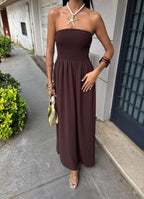 Strapless smocked maxi dress by Shopimist featuring a fitted bodice and flowing skirt, perfect for summer or special occasions.