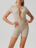 Half zip short sleeve active romper by Trendsi, lightweight athletic wear with a comfortable fit and sporty design.
