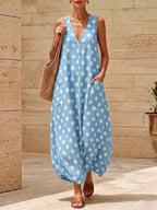 Polka dot V-neck sleeveless maxi dress by Shopimist featuring a flowing silhouette and stylish pattern.