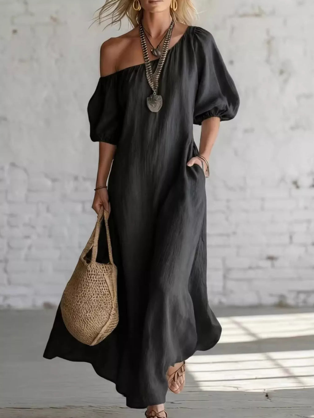 Elegant one-shoulder puff sleeve maxi dress by Trendsi, featuring flowing fabric and a stylish silhouette.