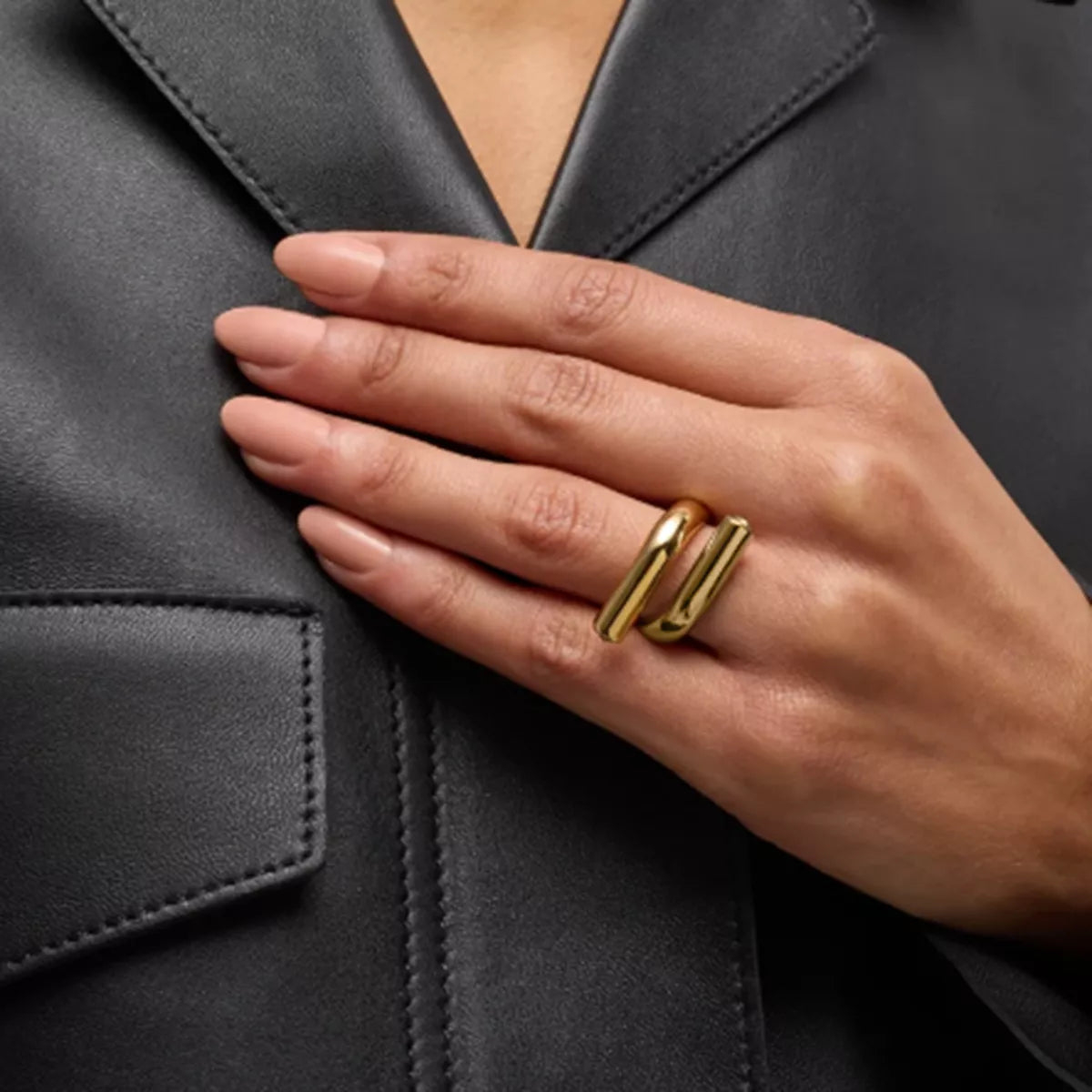 Stainless steel bypass ring from Plush Fashion Hub, showcasing a sleek, modern design with smooth curves and a polished finish.