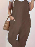 Casual loose fit spaghetti strap jumpsuit with pockets, styled in a relaxed silhouette, by Trendsi.