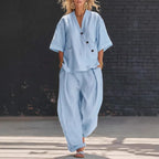 V-neck short sleeve top and high-waist trousers two-piece set by Plush Fashion Hub, shown in stylish fabric and fit.