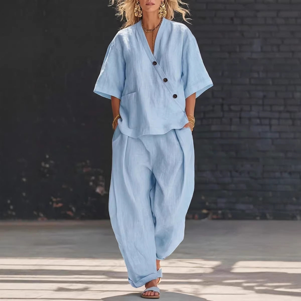 V-neck short sleeve top and high-waist trousers two-piece set by Plush Fashion Hub, shown in stylish fabric and fit.