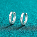 Sterling silver Moissanite Huggie Earrings with sparkling gemstone accents, stylish and elegant jewelry by Shopimist.