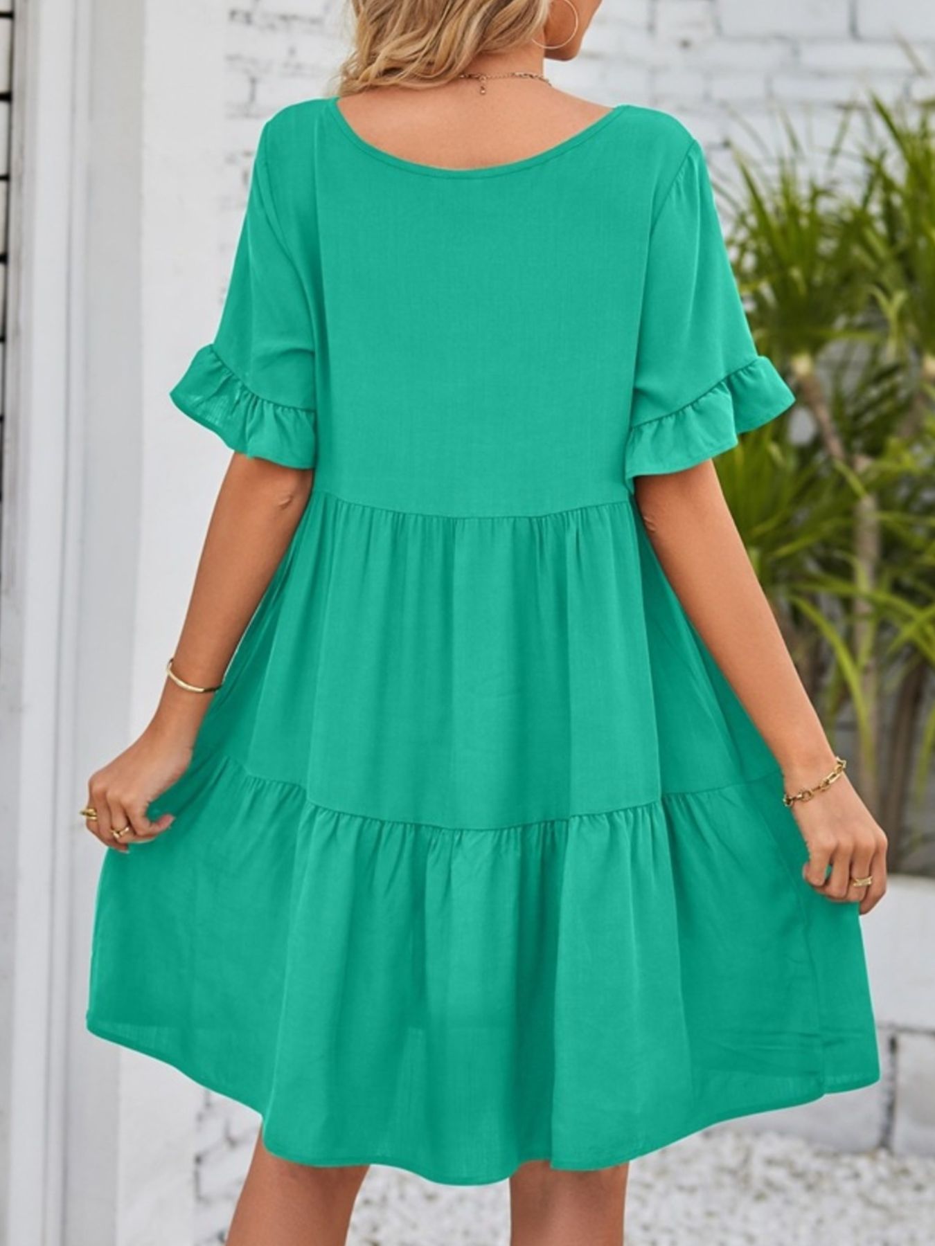 Lightweight rayon ruffled sleeve tiered mini dress with pockets, stylish and flowy, perfect for casual summer wear.