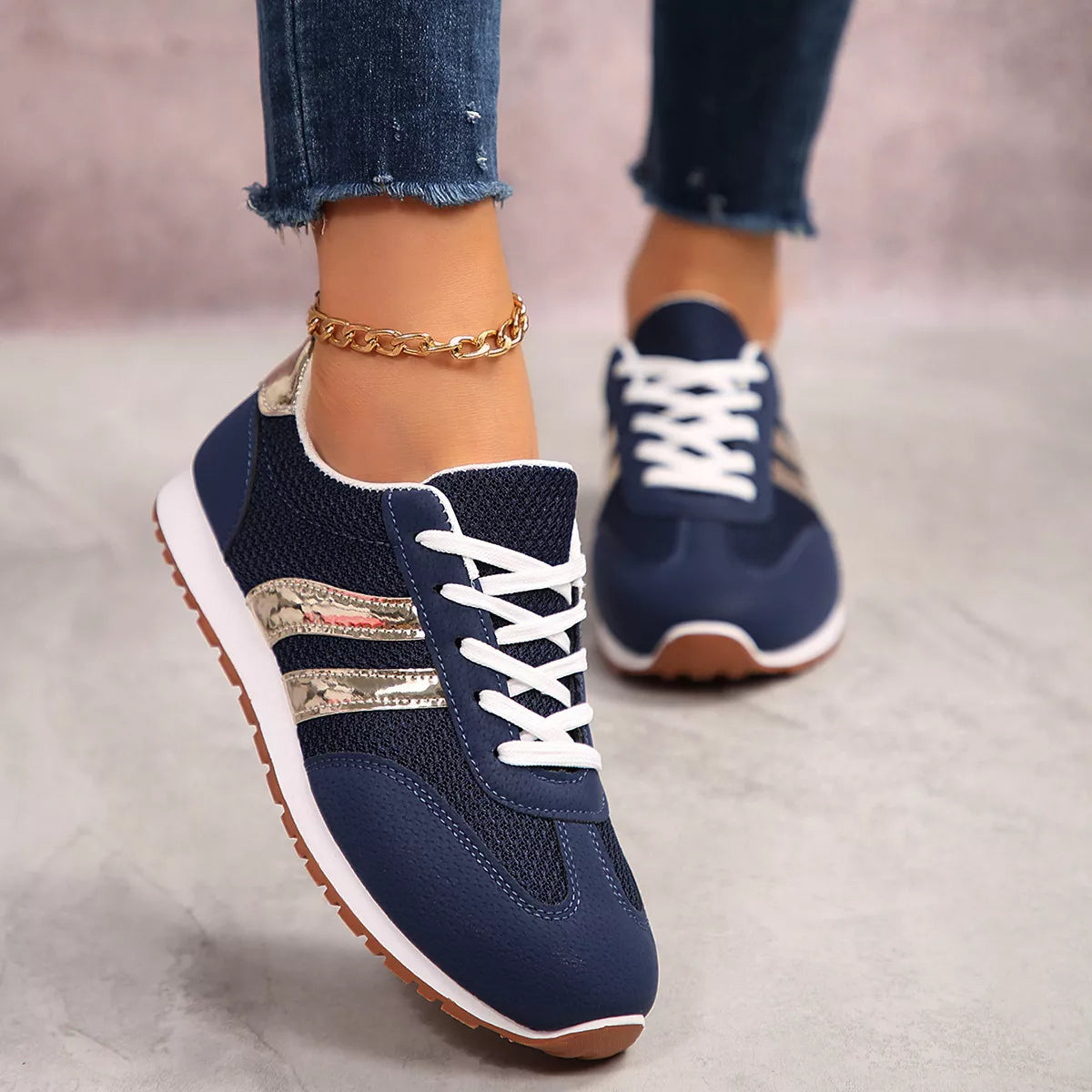 Women's round toe lace-up sneakers by Trendsi, featuring stylish design and comfortable fit, shown in a close-up view