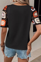 Geometric print round neck short sleeve blouse from Plush Fashion Hub, featuring a stylish pattern and comfortable fit.