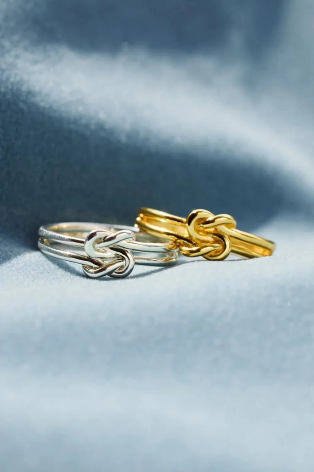 925 sterling silver knotted ring from Plush Fashion Hub, close-up of the elegant, handcrafted design on a plain background.