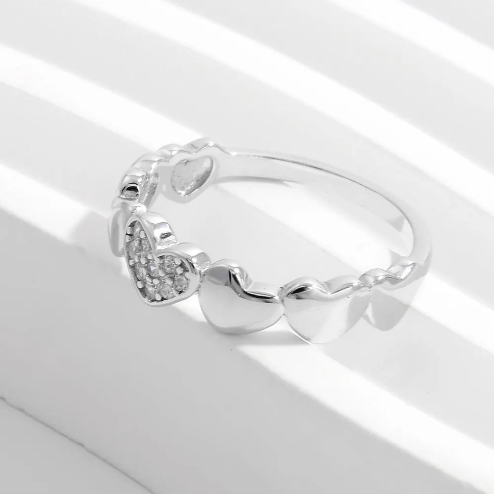 Sterling silver heart-shaped zircon ring from Plush Fashion Hub, showcasing a detailed silver band with sparkling zircon accents.