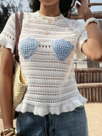 Openwork ruffled hem knit top by Trendsi, featuring a stylish openwork pattern and ruffled hem detail, perfect for casual wear.