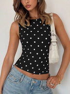 Shopimist polka dot tank top featuring a sleeveless design with a black and white dotted pattern on lightweight fabric.