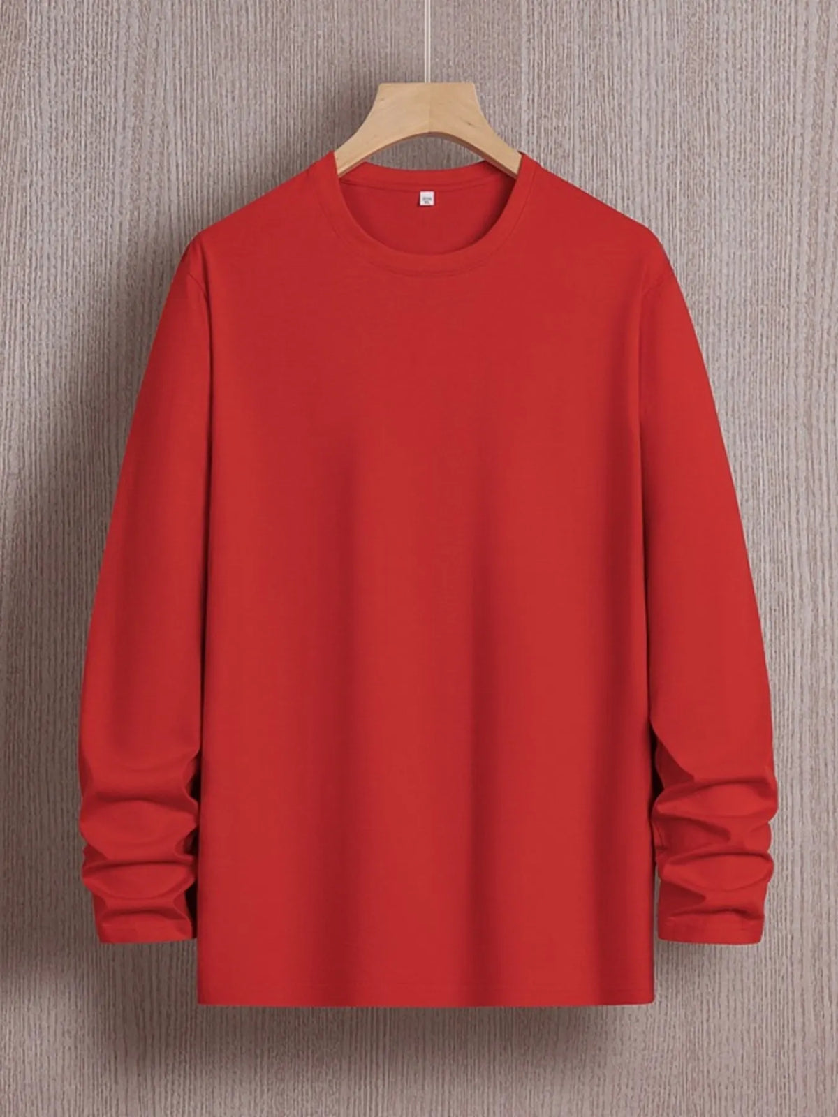 Plus size men's long sleeve round neck T-shirt by Trendsi, featuring a comfortable fit and classic design in a neutral color.