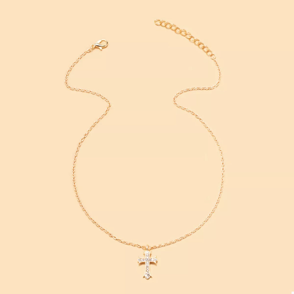 18K gold-plated rhinestone cross necklace with sparkling stones, featuring a delicate chain and detailed cross pendant.