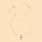 18K gold-plated rhinestone cross necklace with sparkling stones, featuring a delicate chain and detailed cross pendant.