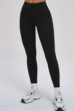 Fitglutes Activewear Kinetic Cross Back Sports Bra and leggings 2-piece set, black and gray athletic gymwear for women.