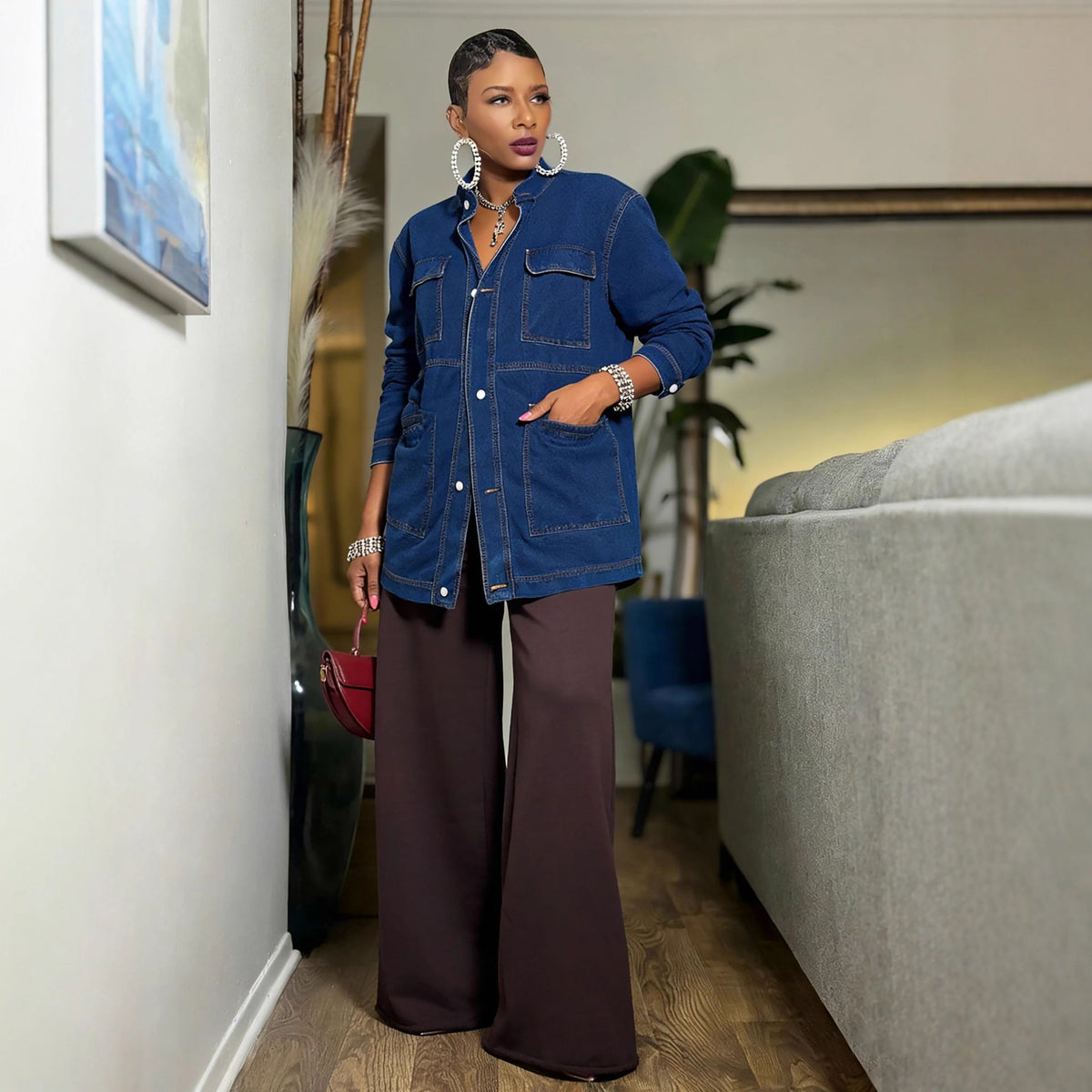 Oversize mid-length cargo denim jacket by eprolo, featuring multiple front pockets and a relaxed fit on a model.