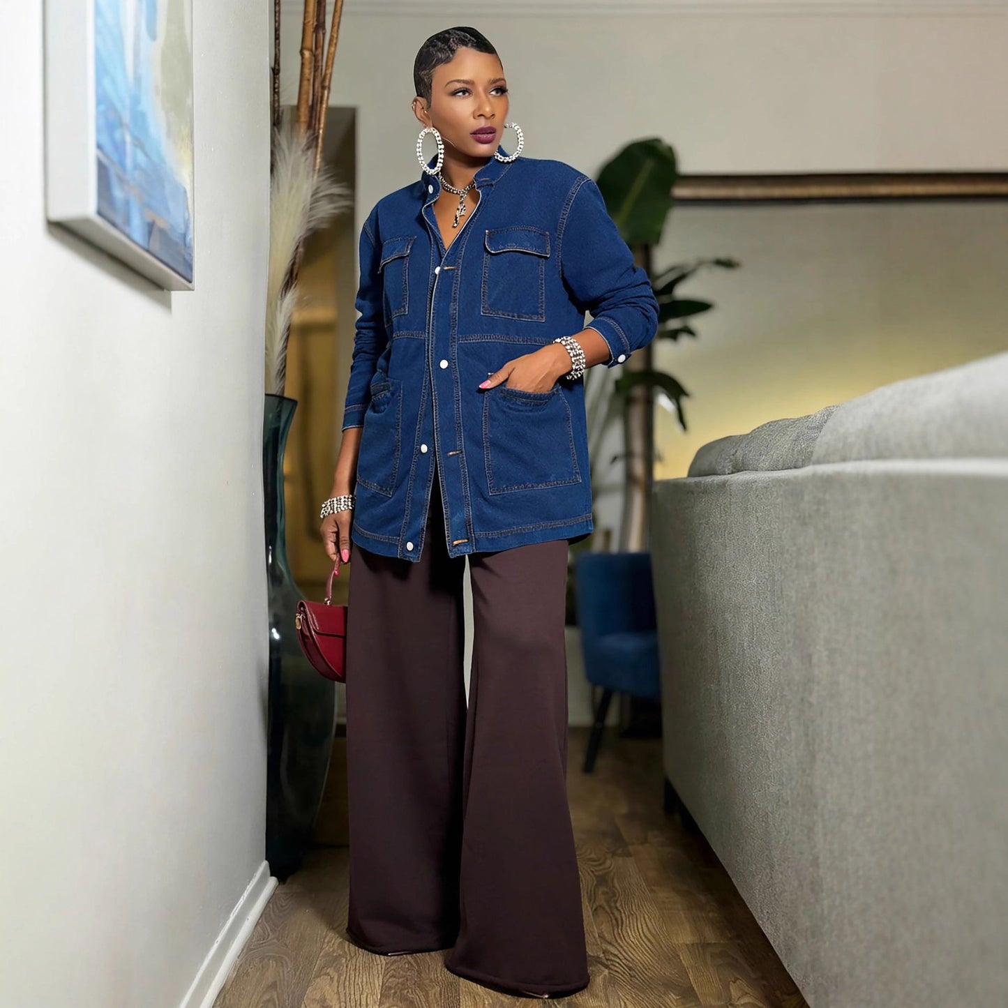 Oversize mid-length cargo denim jacket by eprolo, featuring large front pockets and relaxed fit on a model.