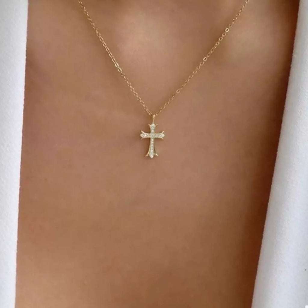 18K gold-plated rhinestone cross necklace with intricate design, featuring sparkling stones on a delicate chain.