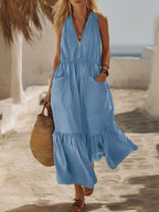 Plus size sleeveless maxi dress with zipper front, pocket details, ruffle hem, by Shopimist, showcasing the full-length dress style.