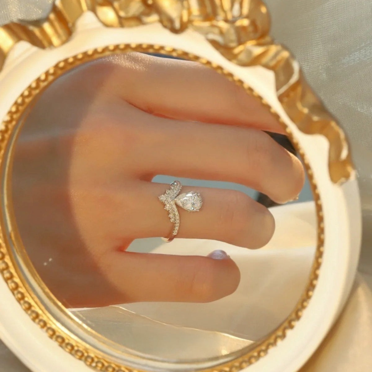 Sterling silver 1.5 carat moissanite ring with a sparkling center stone and intricate band design.