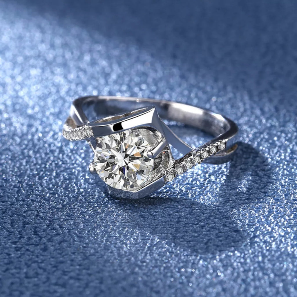 Sterling silver moissanite ring with a 1-carat center stone, featuring a sleek and elegant design.